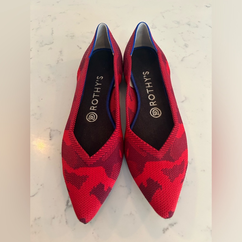 Rothy’s the Point in red print. Perfect condition.
